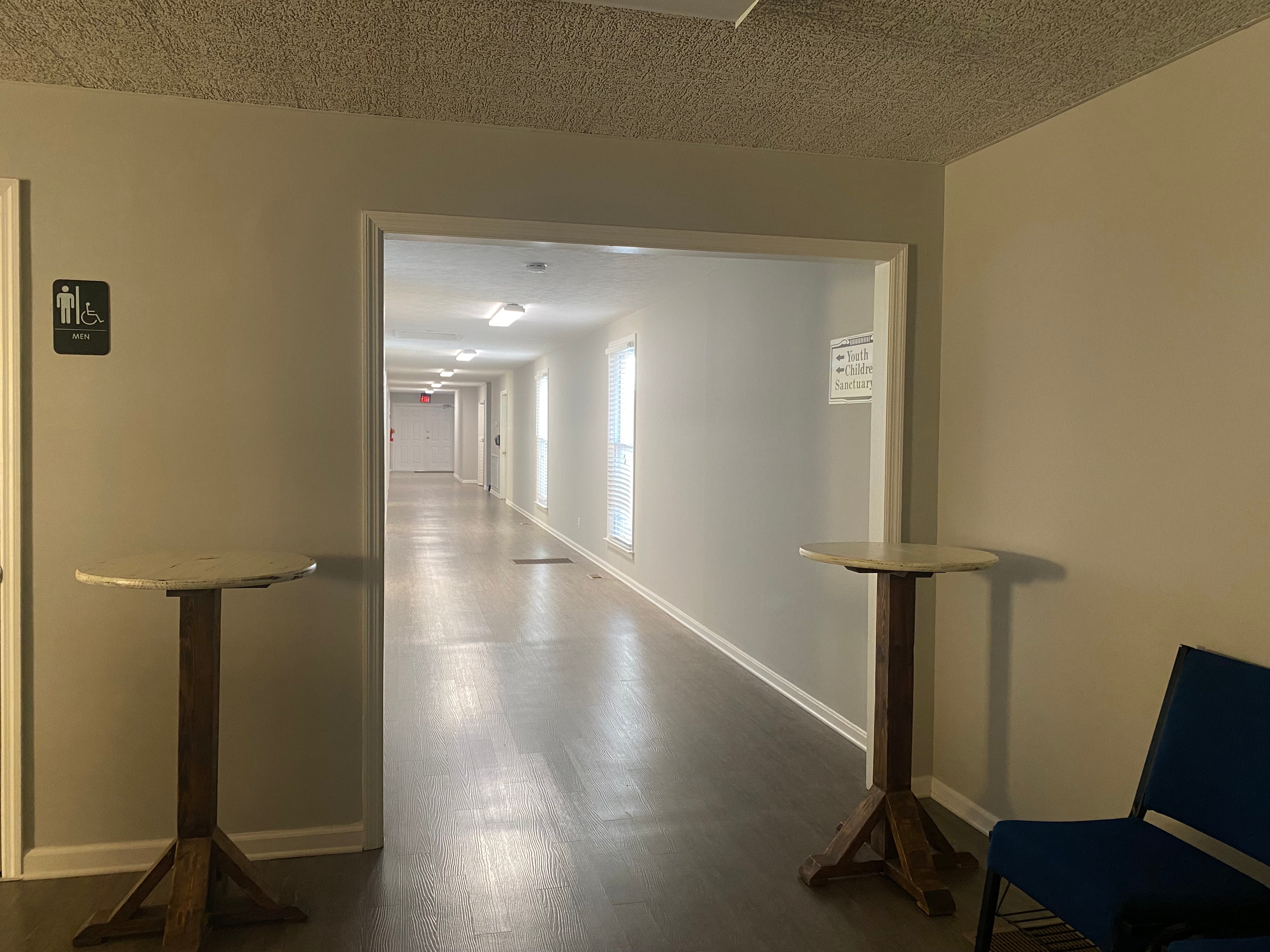 Plain white hallway before children's ministry mural installation at Damascus Baptist Church in Appling, Georgia