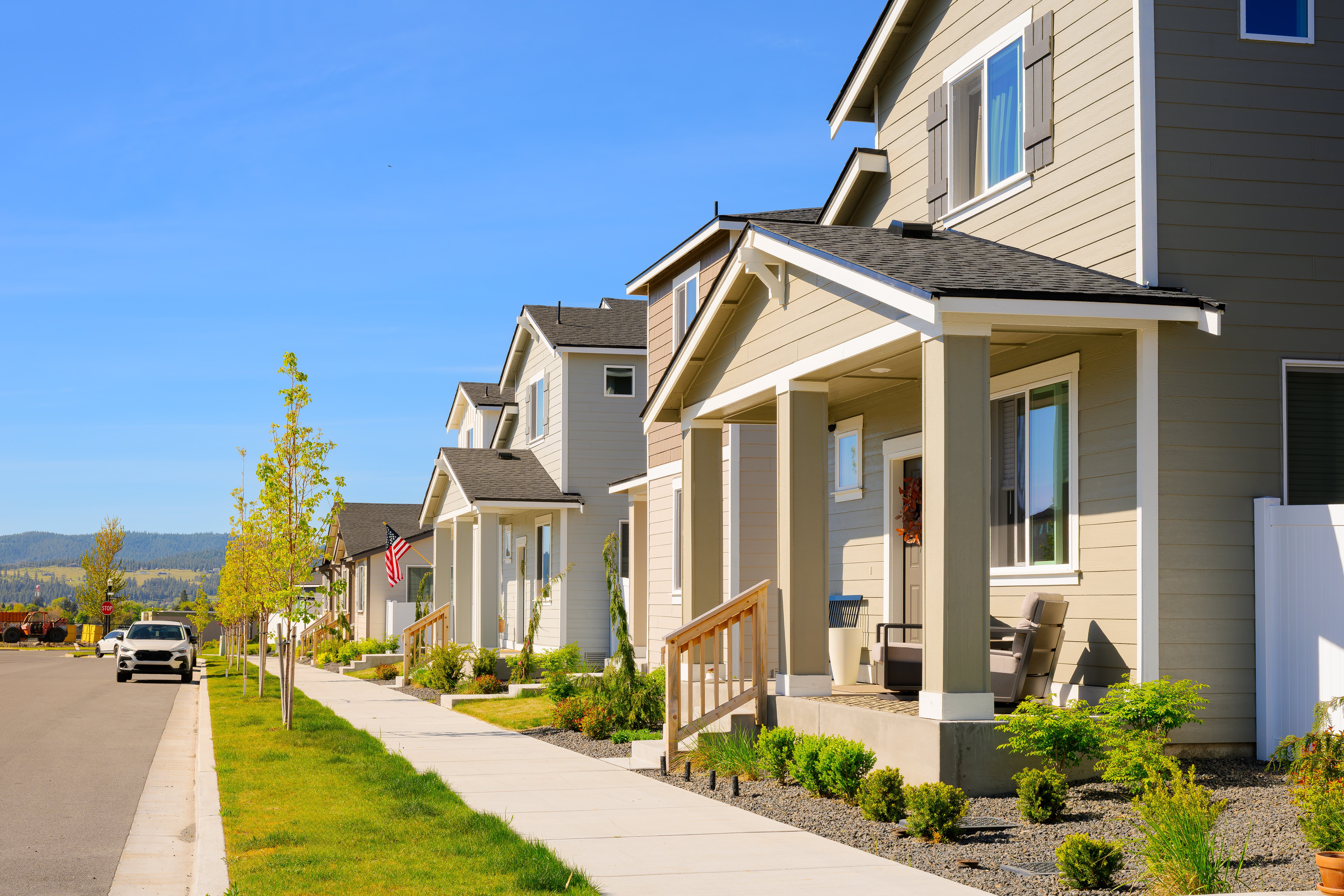 Modern neighborhood with neutral-colored homes illustrating today's trend toward muted residential color palettes.