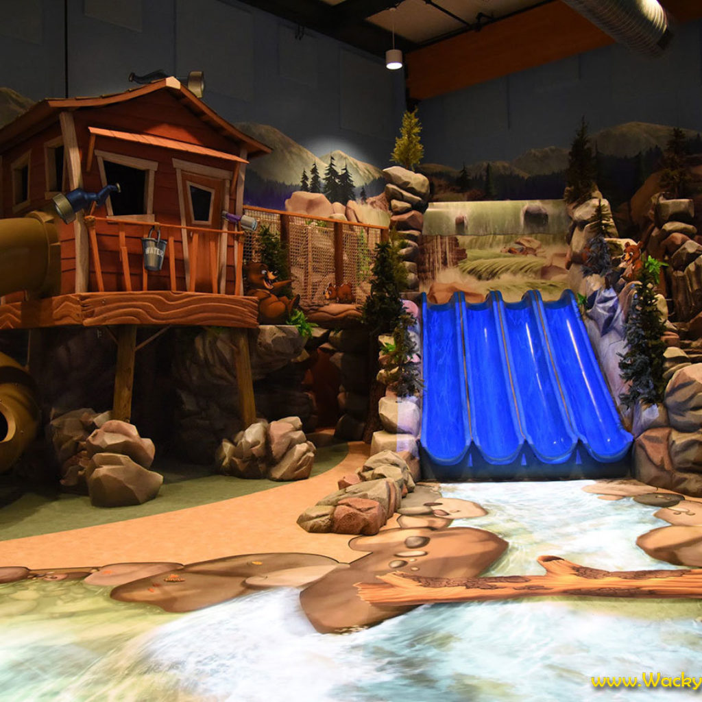 Ranger Station with slide plus large multi slide and rock staircase and animated river in a Fully Immersive Camping  & Lodge Themed Environment at Abundant Life Church