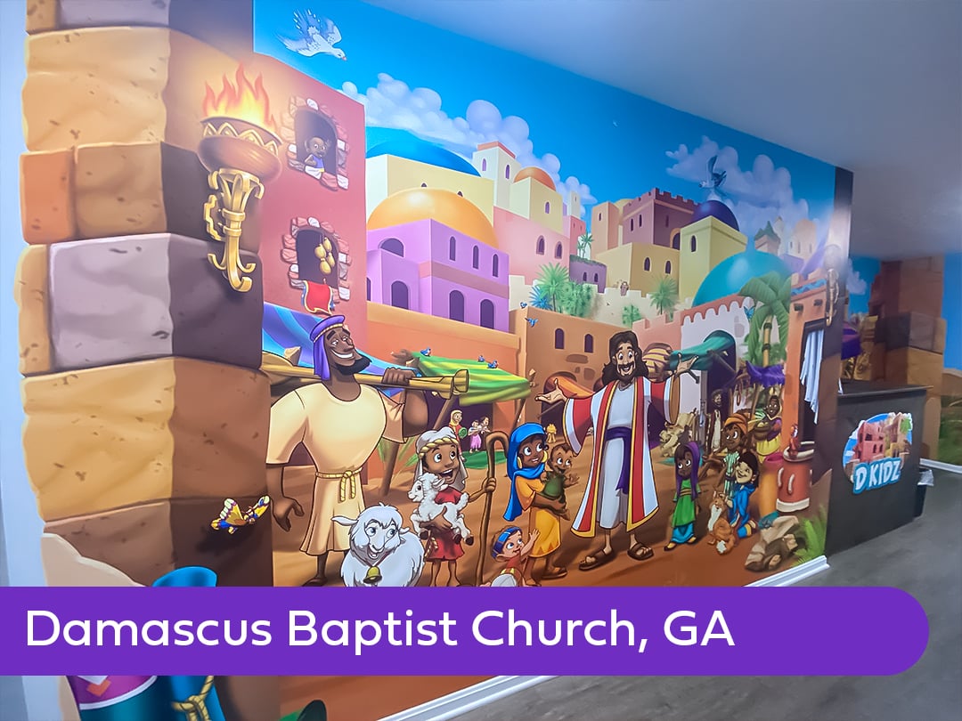 Large-format children's church mural depicting Jesus and children in a bustling Bible-times village, creating an immersive biblical storytelling environment.