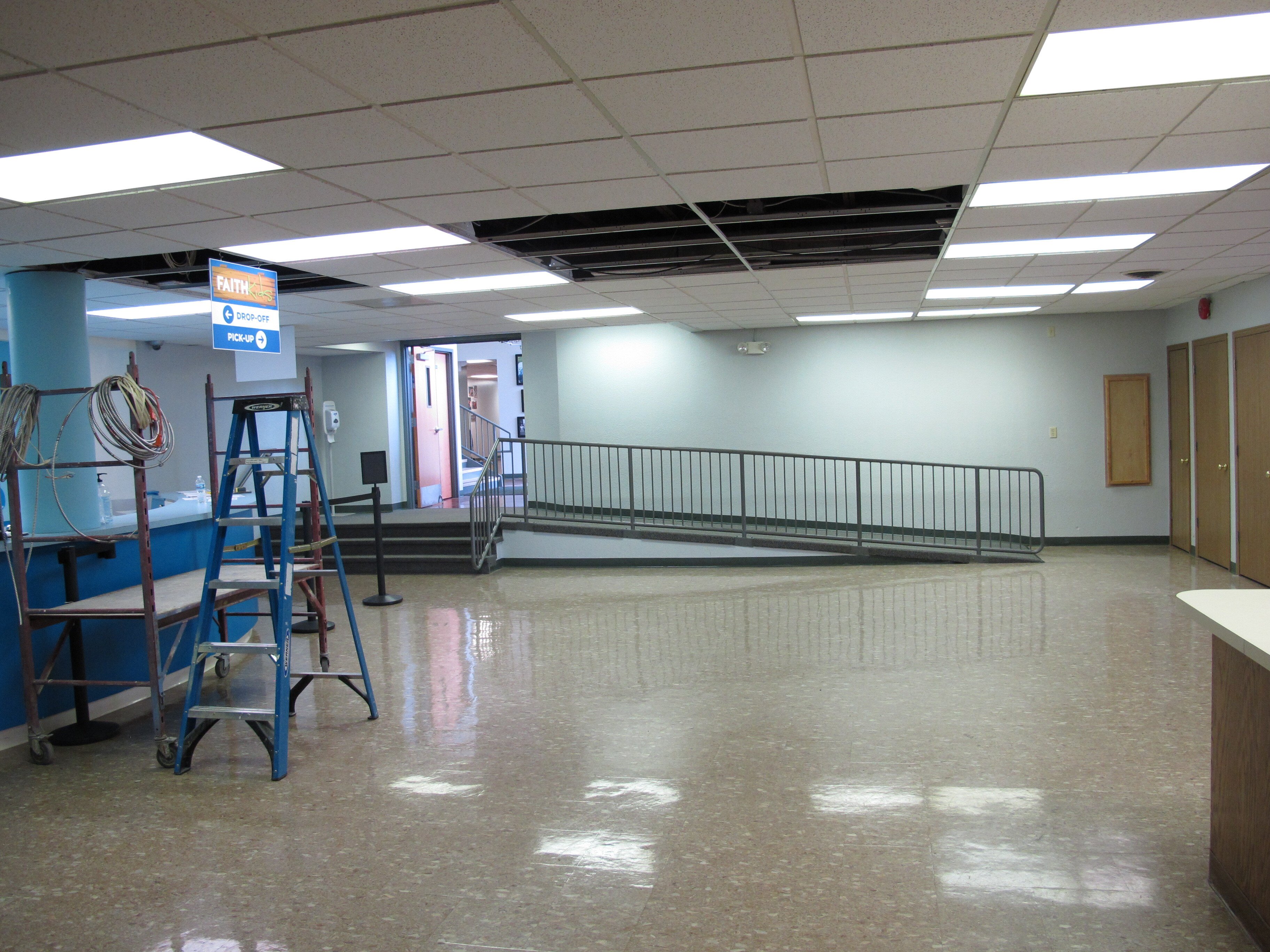 Before photo of Faith Community Church's children's ministry lobby prior to its transformation into an immersive camp-themed FaithKids environment.