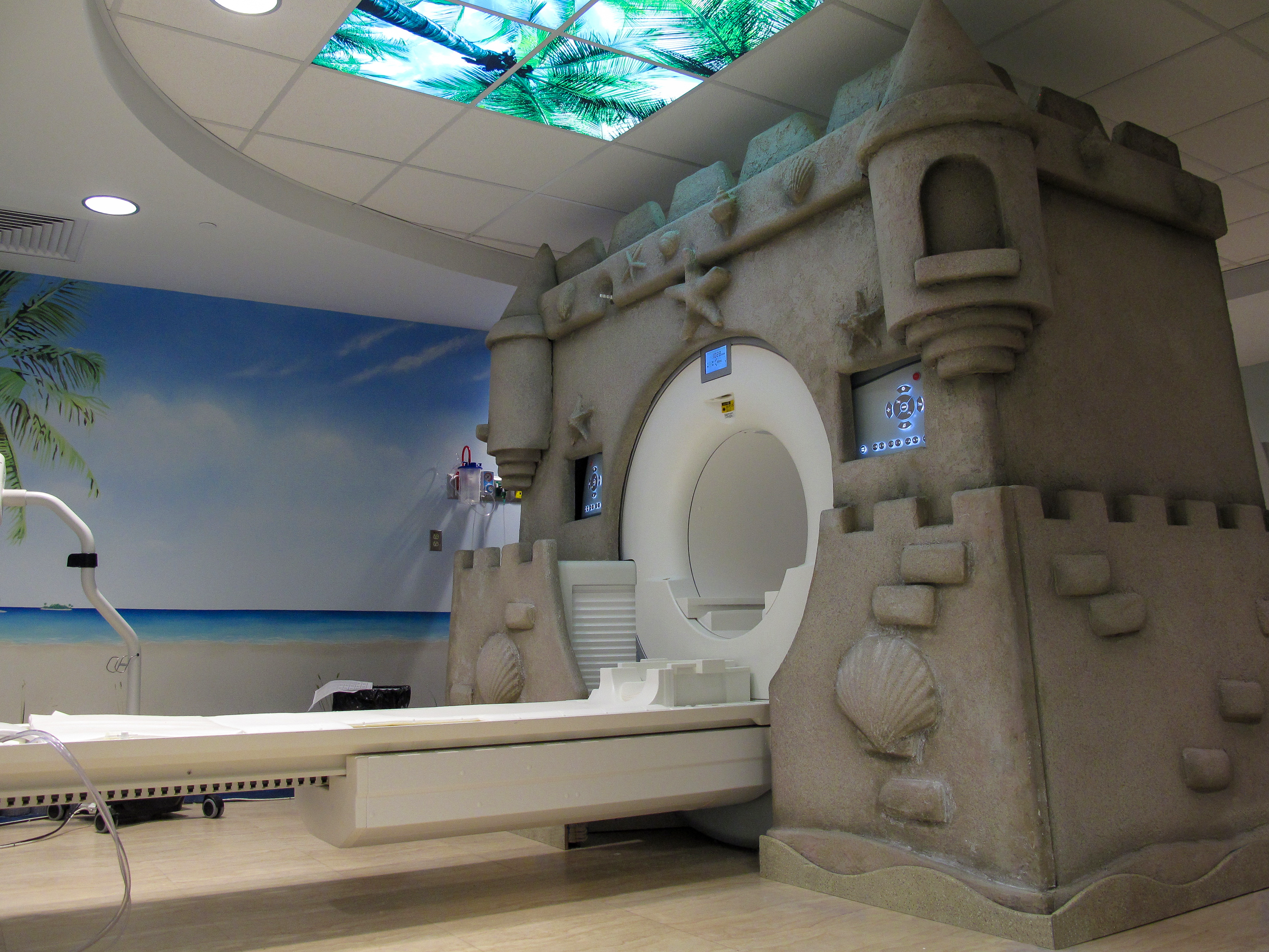 Sandcastle-themed MRI scanner creates a playful pediatric healthcare environment designed to make medical imaging feel less intimidating for children.