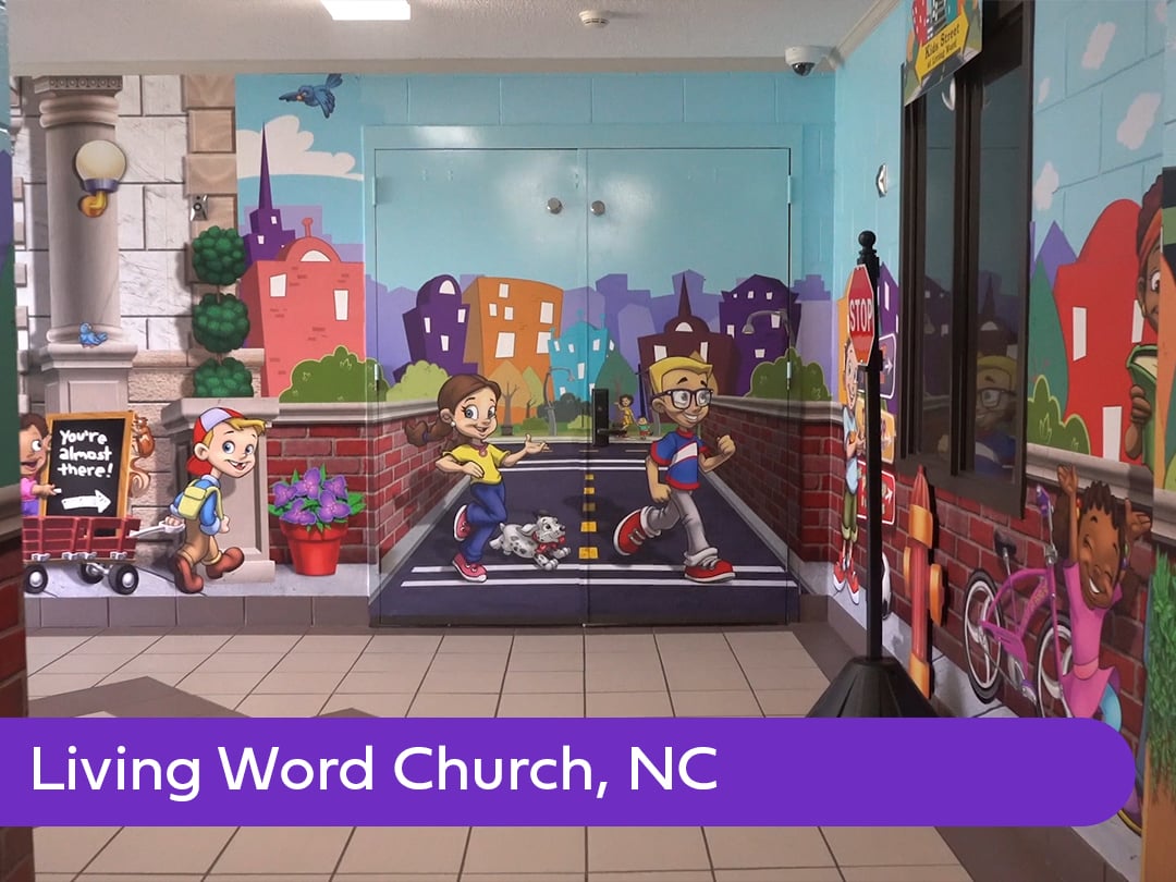 Neighborhood-themed children's ministry hallway at Living Word Church featuring custom murals, dimensional details, and playful wayfinding elements that guide families through the space.