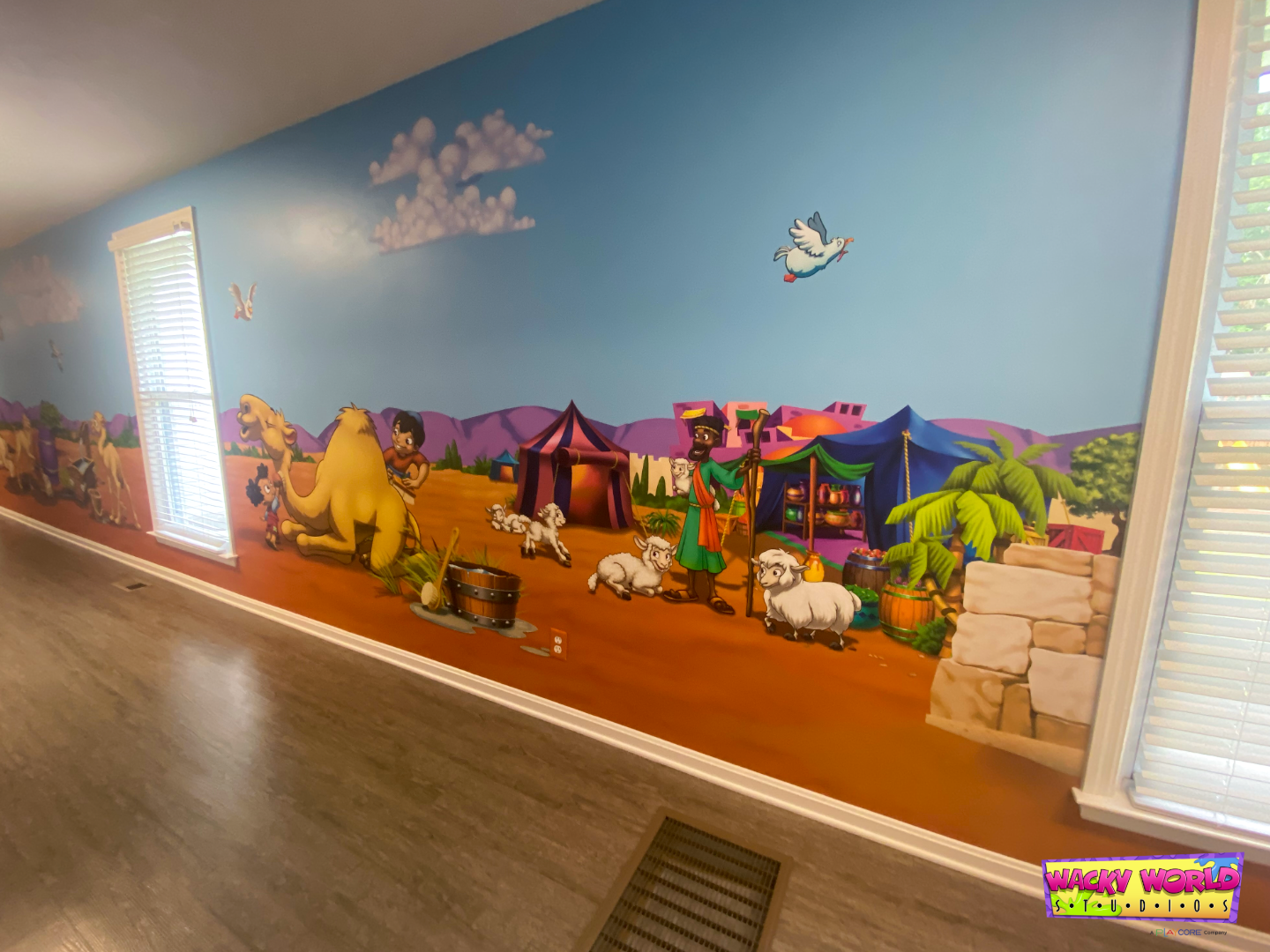 Immersive children's ministry environment featuring floor-to-ceiling Bible-themed wall murals and marketplace graphics