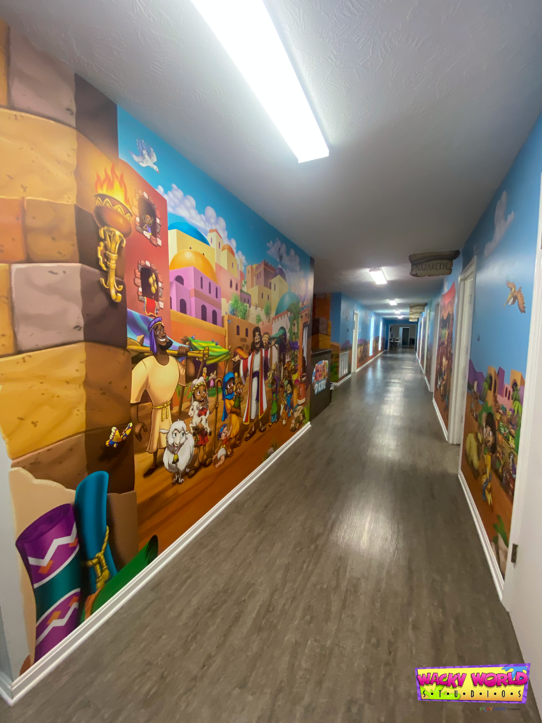 Church wall murals creating an immersive Bible marketplace experience for children and families