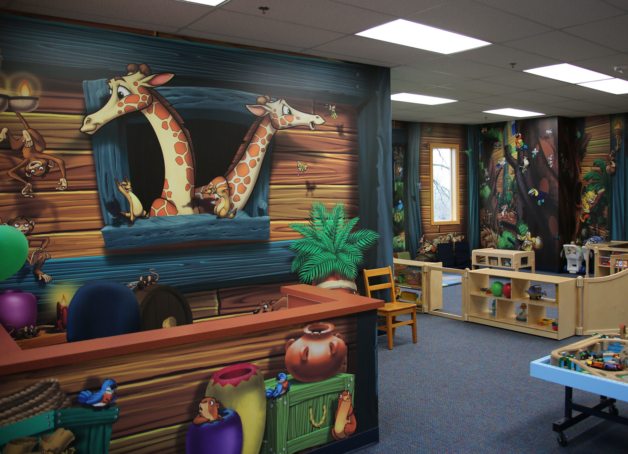 Nursery with a Noah's Ark theme featuring murals with Giraffes, monkeys and more as shown on the Ark.