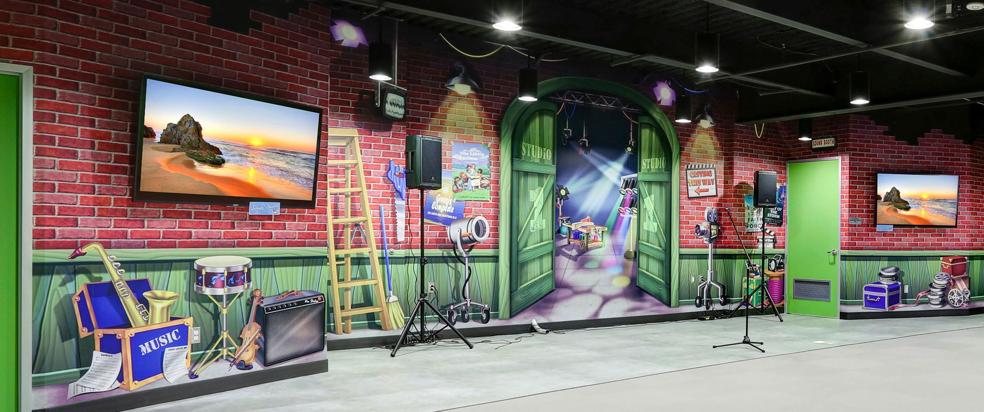 Backlot Studios Themed Wall Covering Stage Backdrop featuring a brick wall, green board wainscots, props, lights, tools and more at Mount of Olives