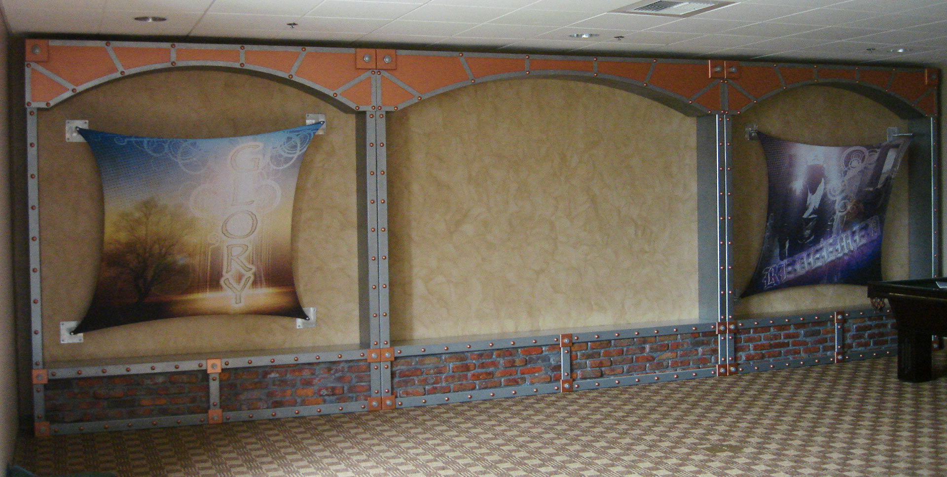 Sculpted wainscot facade of faux brick and steel with 2 Edgy Youth Stretched Canvas Sound Panels