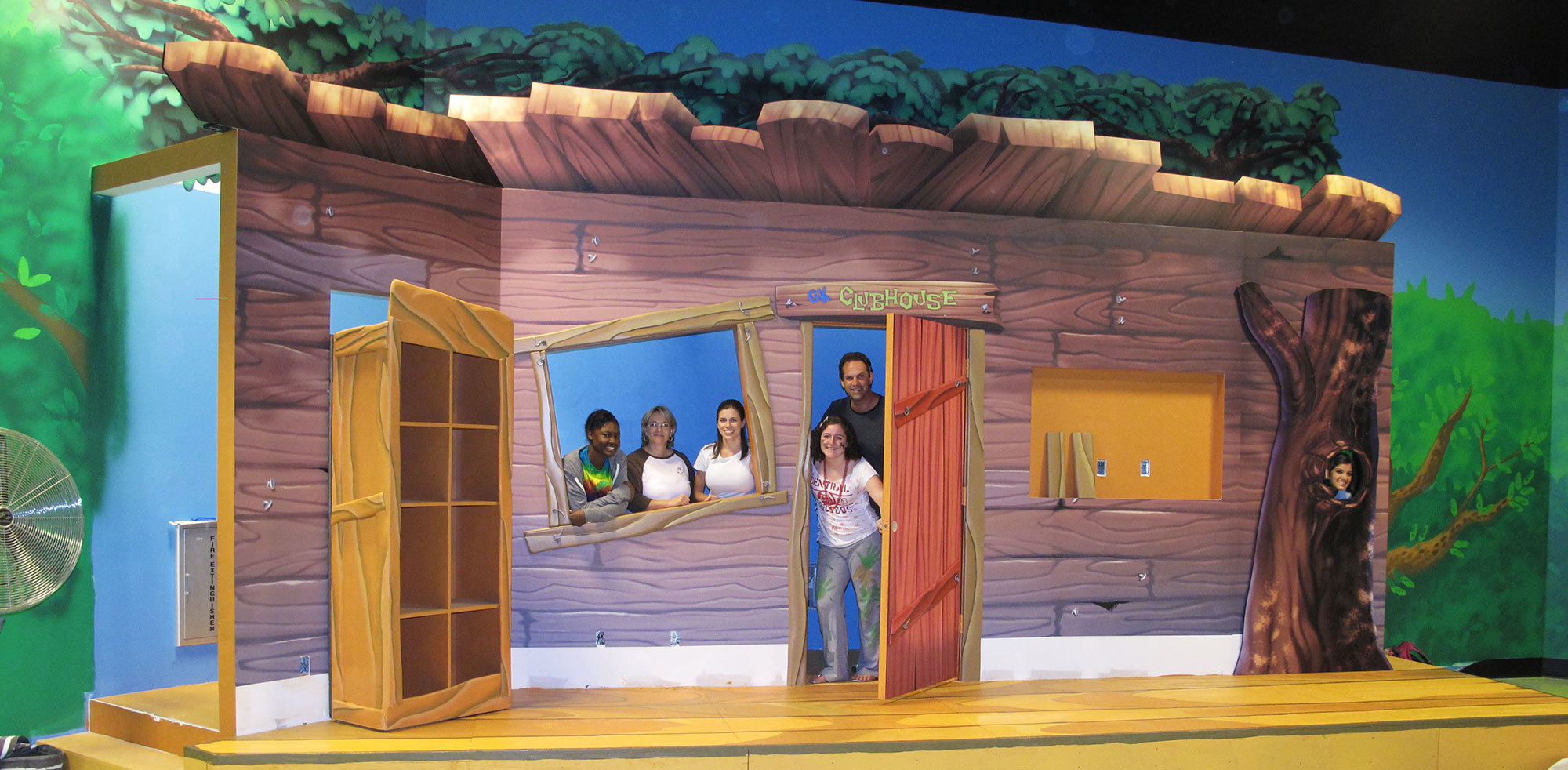 Treehouse Themed Stage with clubhouse facade, window and door and bookcase at Christ Fellowship Royal Palm Beach