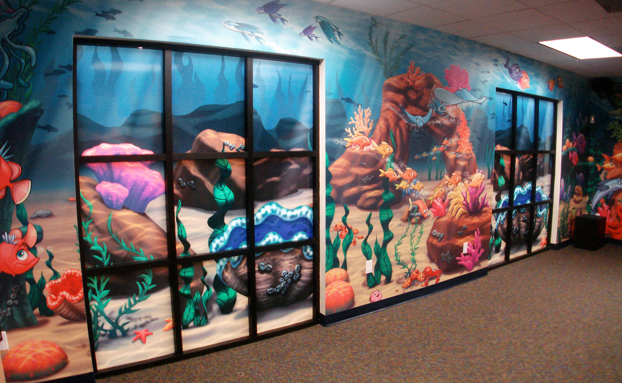 Example of Undersea Themed Window Vinyl with Wall Covering depicting sea floor with coral reef, fish and plants at a Church