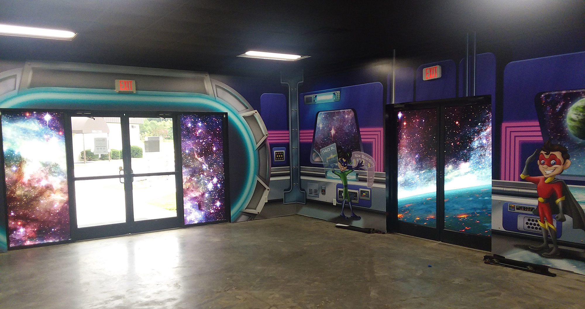 Example of Window Vinyl and murals in a Space Themed Space at a Church, featuring views of the stars and the interior of a space station with kid characters.