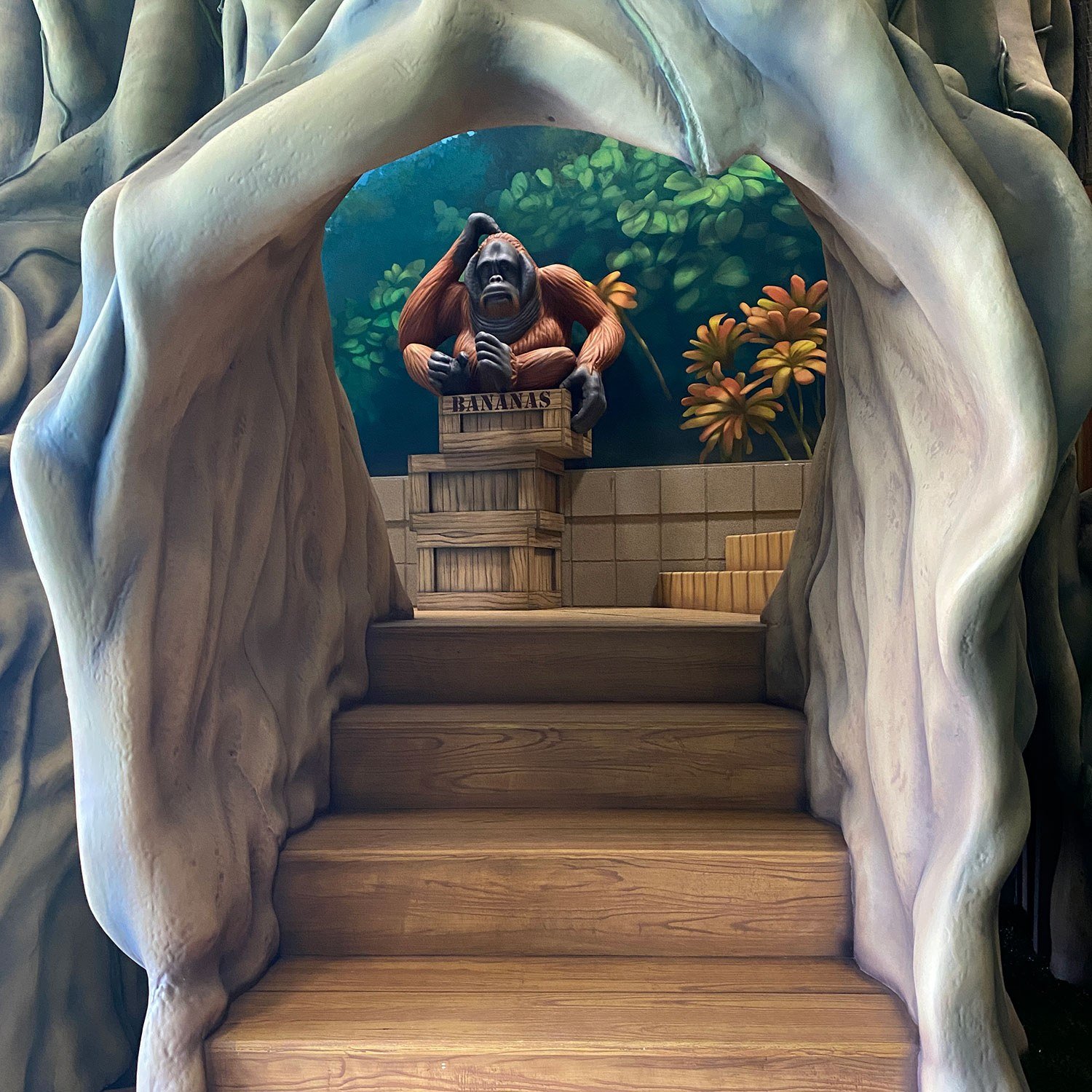 Stairs and 3D sculpted Orangutan at West Chicago Park District Treetop Escape themed environment