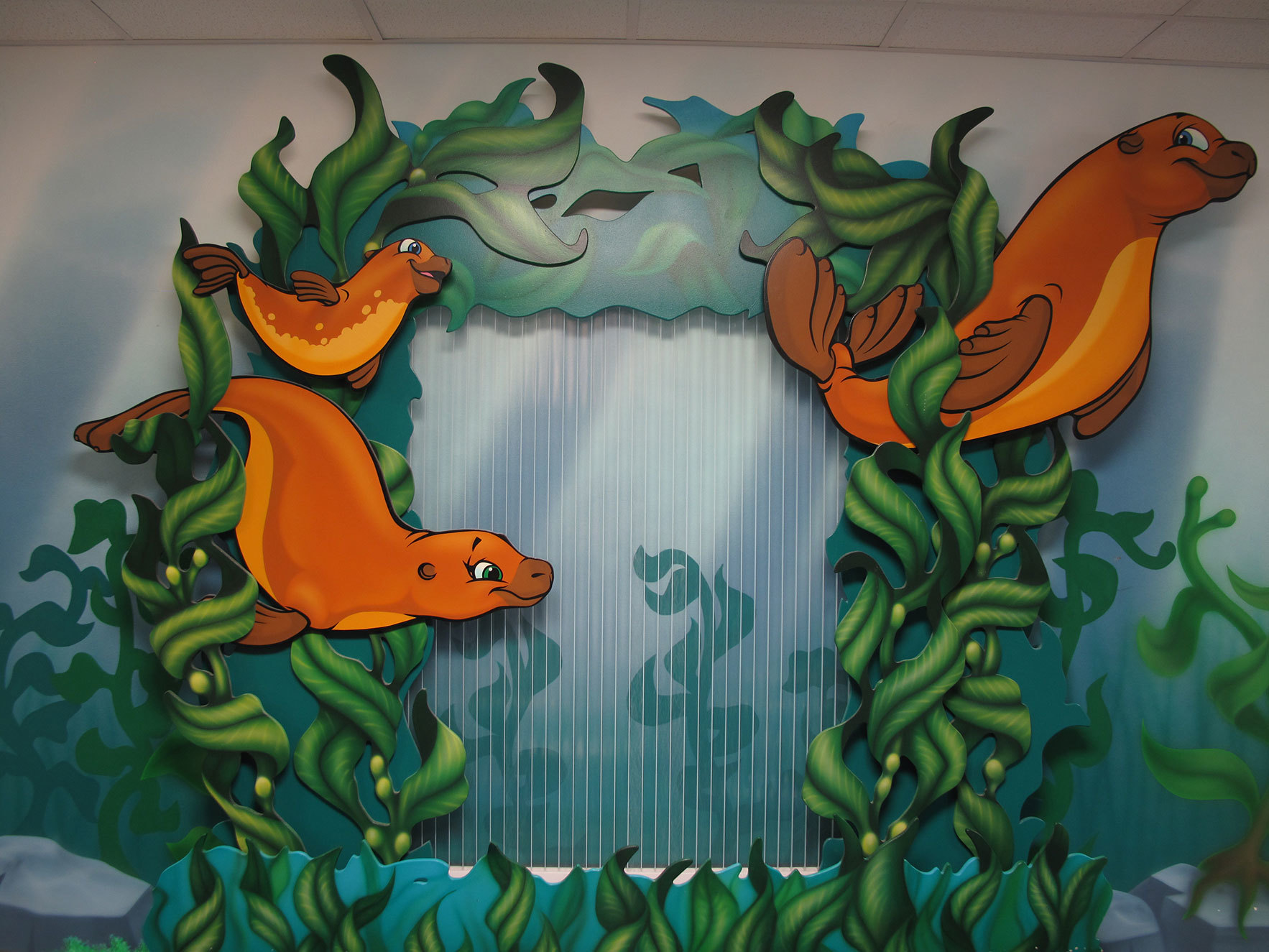 2D Sea Lion Cutouts with plant life around Bubble Wall