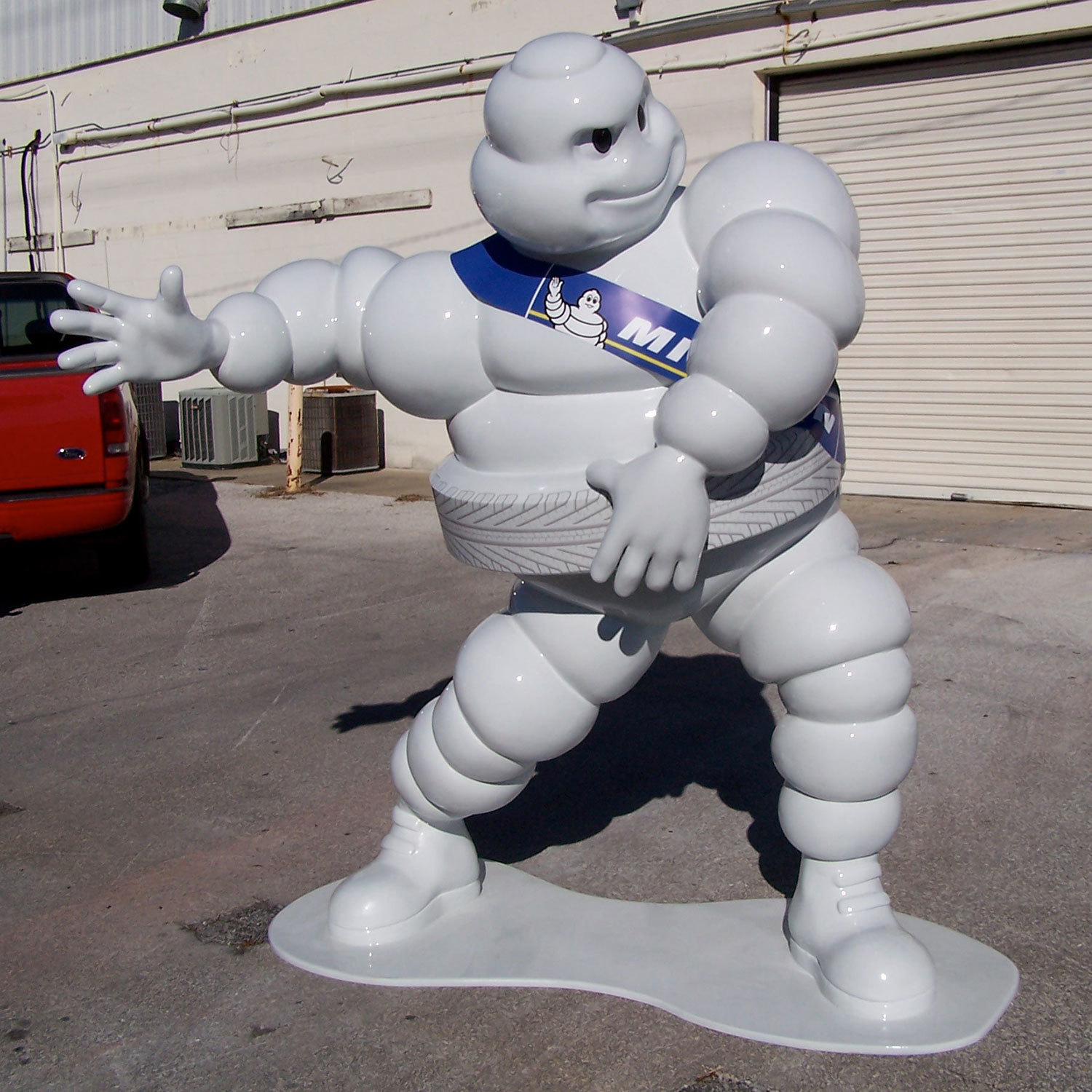 3D Sculpted life-sized white Michelin Man character statue.