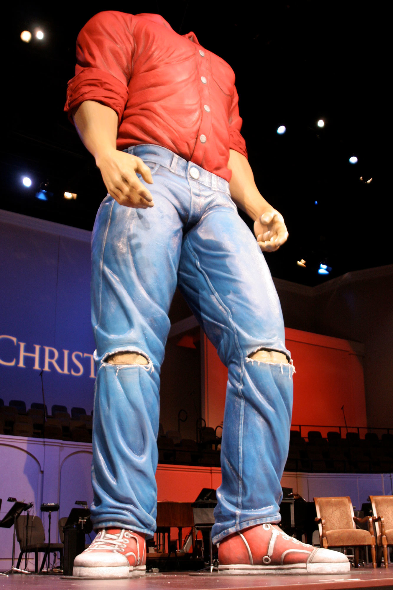 Giant 40 foot tall sculpted 3D Man with a red shirt and blue jeans for a Church sermon series