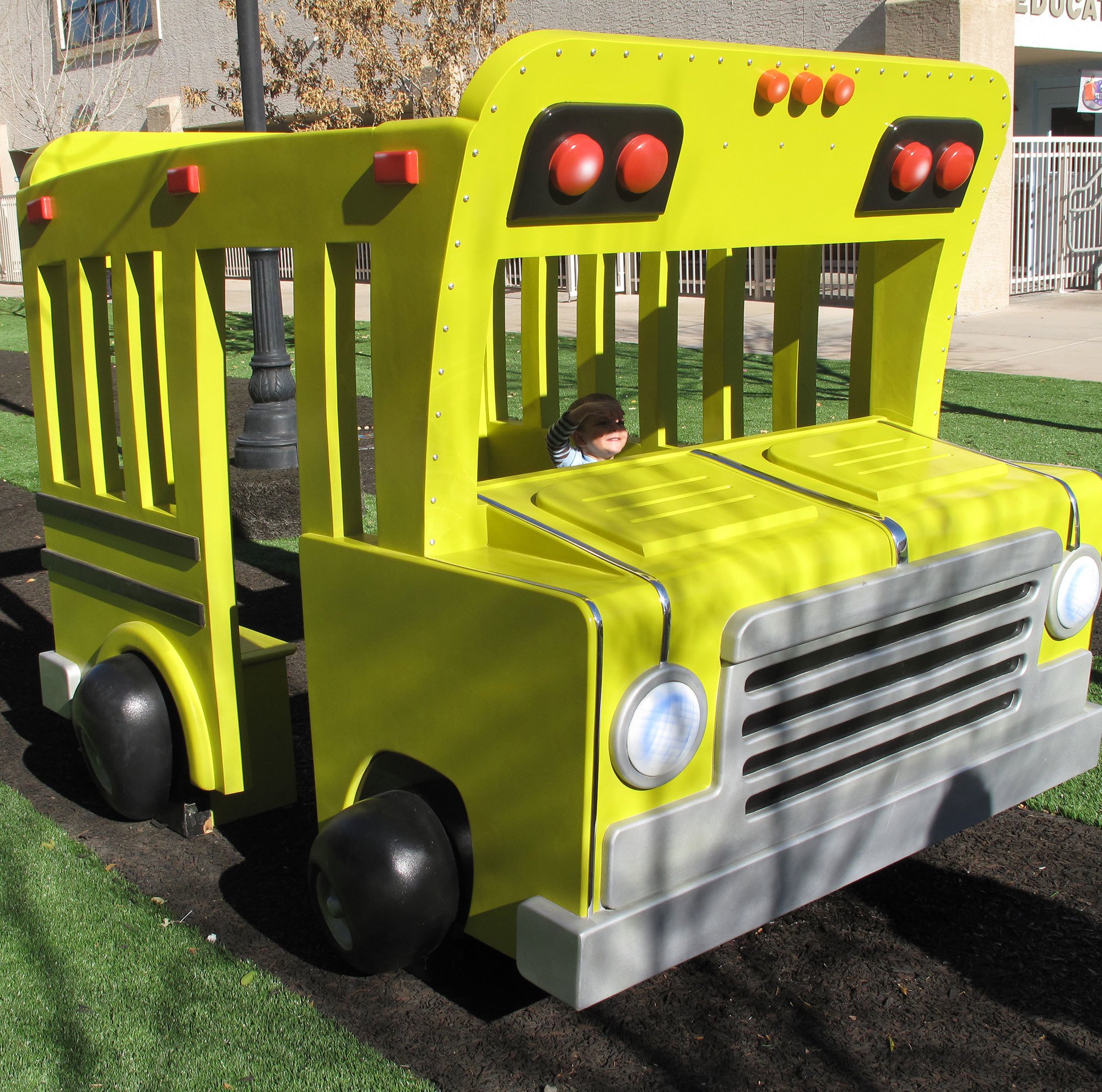 3D yellow School Bus play feature in a Toon Town Car Play Area Themed Environment at Casas Church
