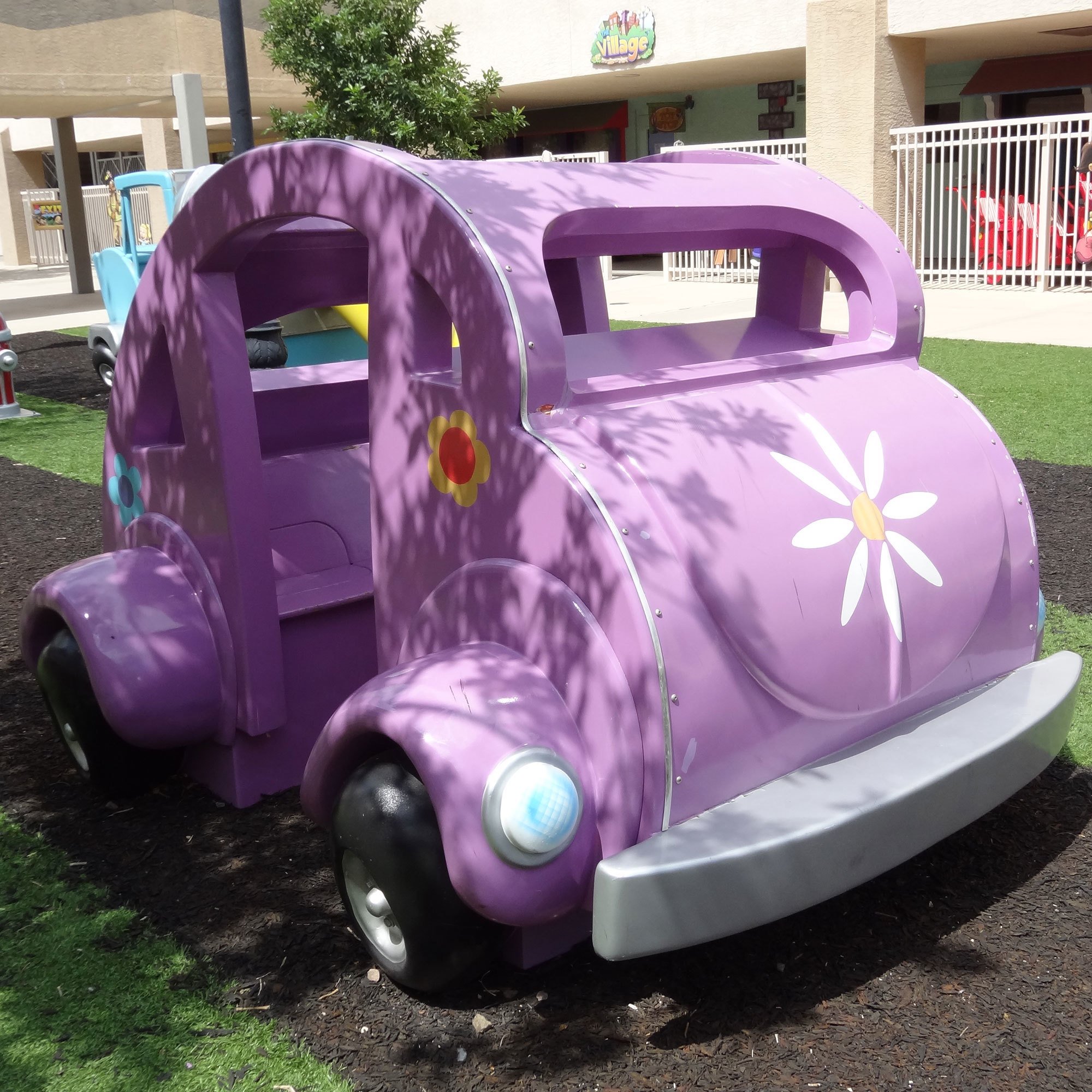3D Lavender colored car parked outdoors in a Toon Town Car Play Area Themed Environment at Casas Church