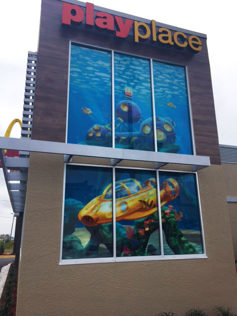 Exterior view of Undersea Themed Window Vinyl with a yellow sub and fish at McDonald's