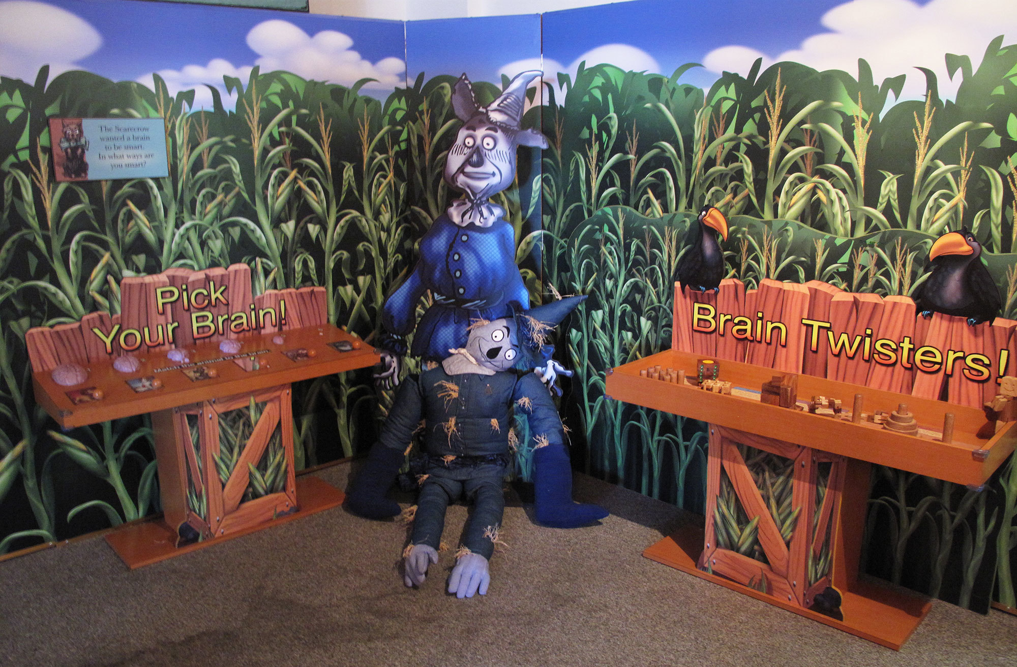 3D scarecrow with cornfield mural background and 3D interactive kiosks at Wizard of Oz Interactive Display at Great Explorations Museum