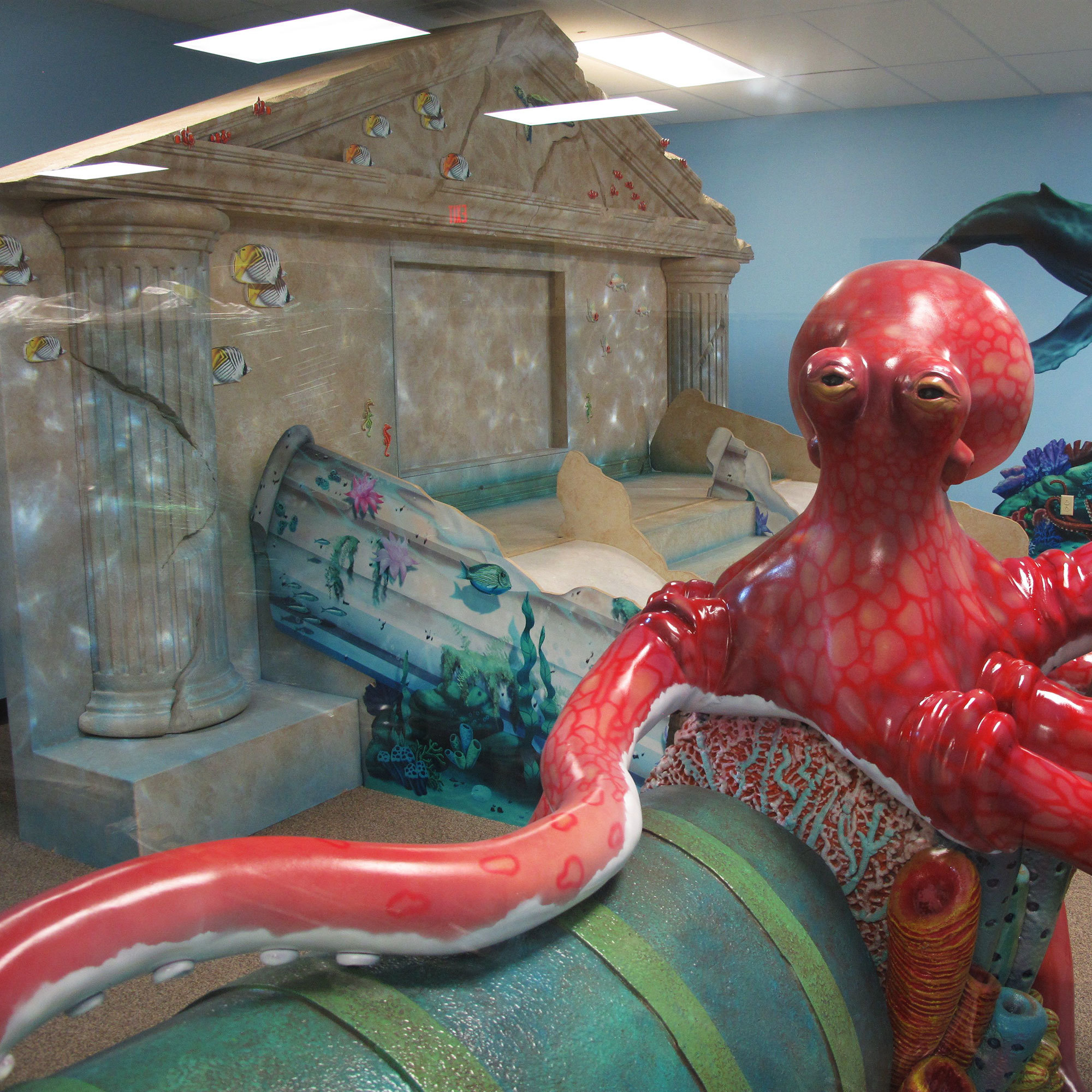 Undersea and Lost City of Atlantis Themed Play Area with giant 3D sculpted octopus and fallen column and Arch facade from Atlantis.