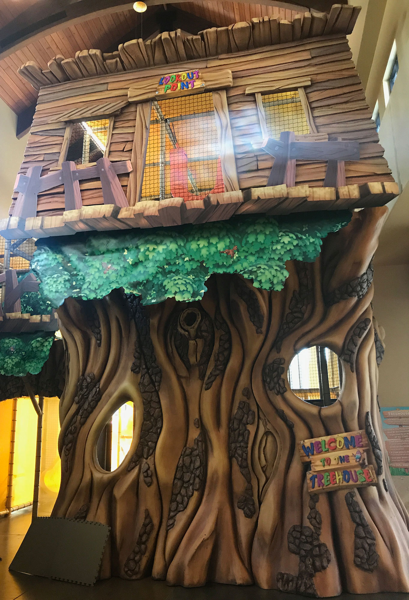 3D Sculpted Treehouse Play Area Facade with signs reading "Lookout Point" and "Welcome To The Treehouse".
