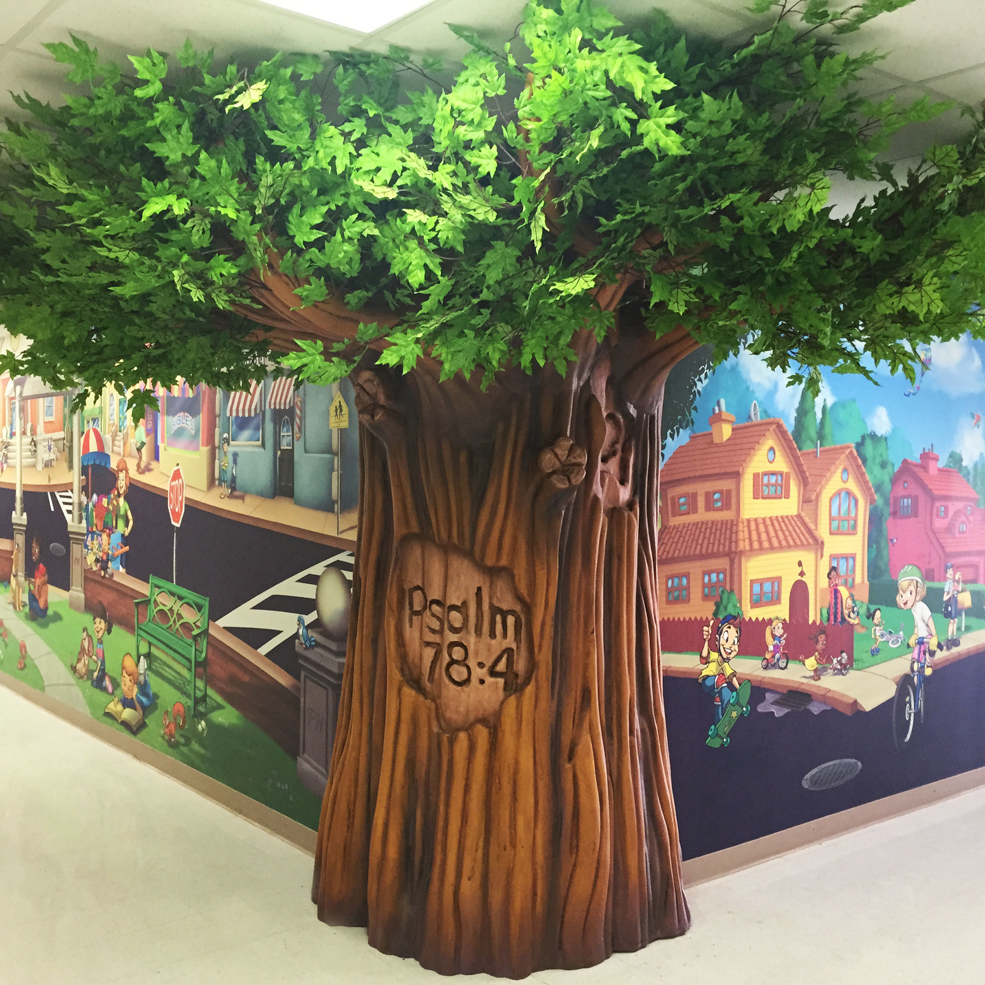 Example of 3D Sculpted Tree with toon town wall mural at a Church