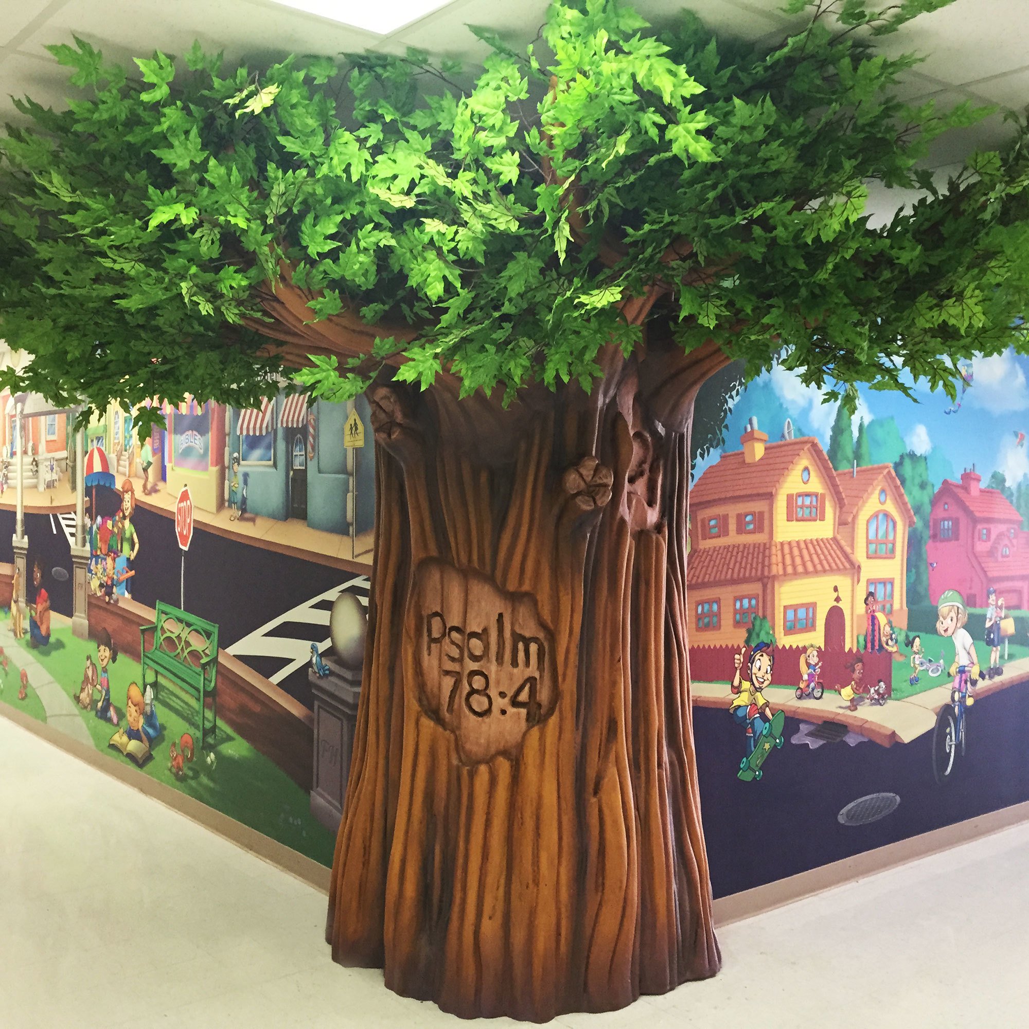 Example of 3D Sculpted Tree with toon town wall mural at a Church