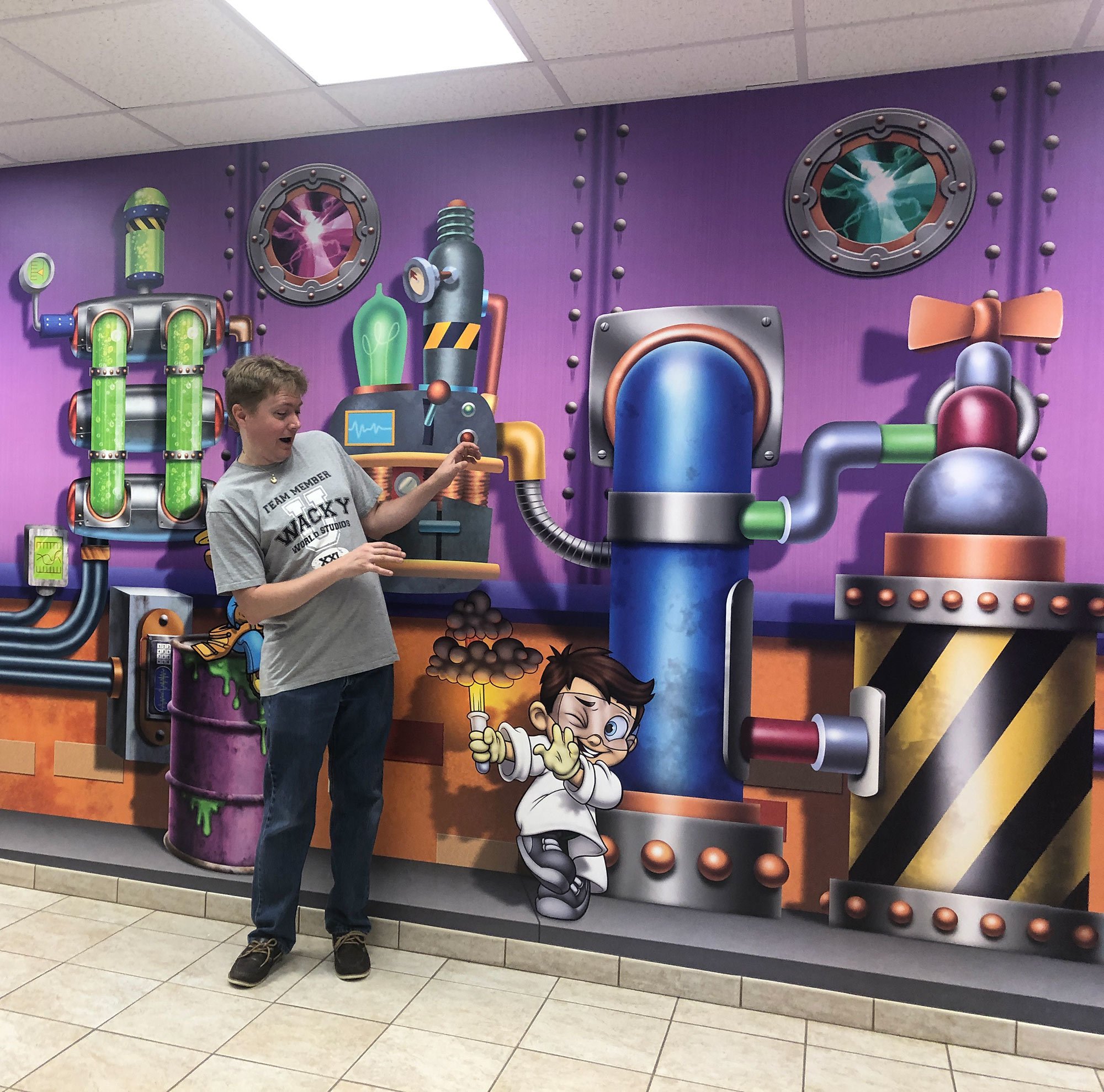 Steven with Science Lab Wall Covering at London Bridge Church